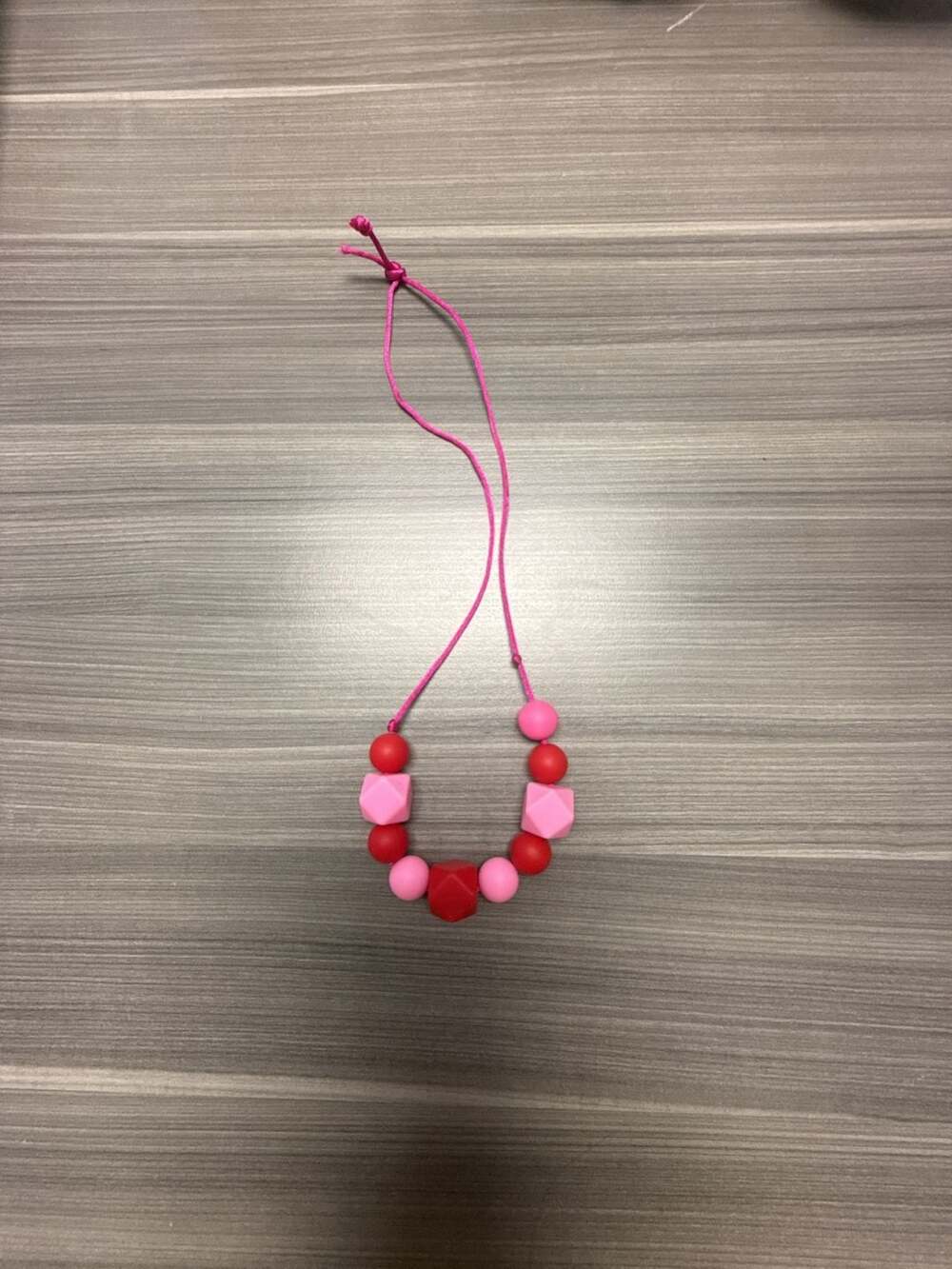 Silicone Teething Sensory Chew Necklace in Pink and Red - Picture 1 of 3